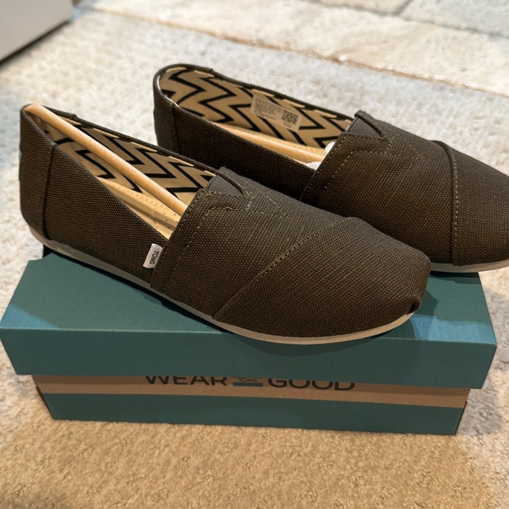 Brand new.  Never worn olive green Tom’s.  Size 7